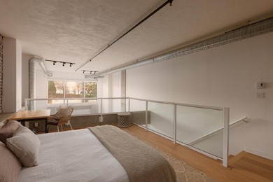 This two-level, 1 bedroom (potential for 2) Gastown loft sits on - photo 18