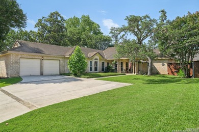 Set on nearly a quarter-acre in a highly sought-after, guarded