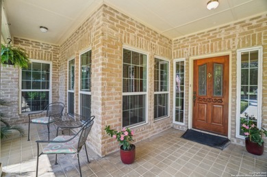 Set on nearly a quarter-acre in a highly sought-after, guarded