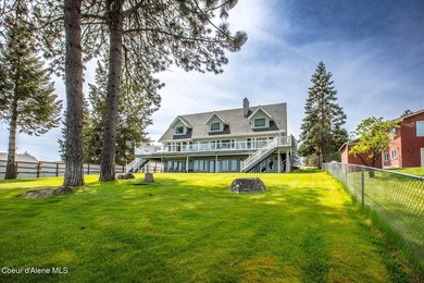 Timeless waterfront retreat with soaring cathedral ceilings, an - photo 2