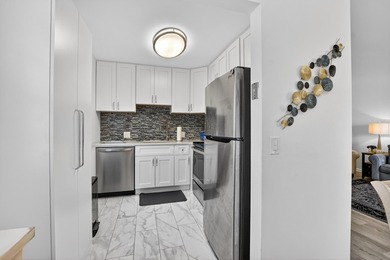 Beautifully RENOVATED 2nd floor CORNER condo in Century Village - photo 12