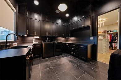 Luxury custom home in Heath, TX with soaring ceilings, walls of - photo 27
