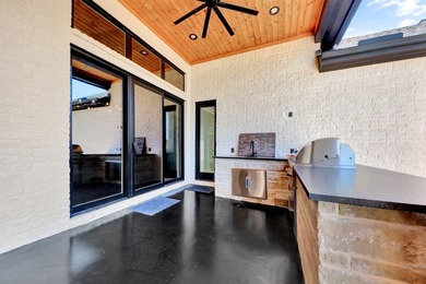 Luxury custom home in Heath, TX with soaring ceilings, walls of - photo 28