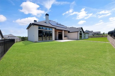 Luxury custom home in Heath, TX with soaring ceilings, walls of - photo 32