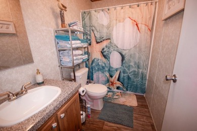 *NO FLOOD ZONE * Welcome to this turnkey coastal retreat nestled - photo 12