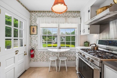 Tucked away on a desirable village street, this circa-1927 home - photo 8
