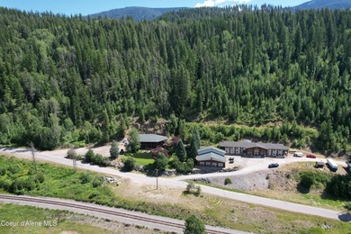 Escape to the rugged beauty of North Idaho with this exclusive - photo 8