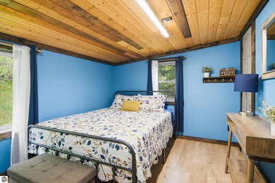Set on 10 acres just outside Manton, this thoughtfully updated - photo 15