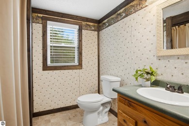 Set on 10 acres just outside Manton, this thoughtfully updated - photo 17