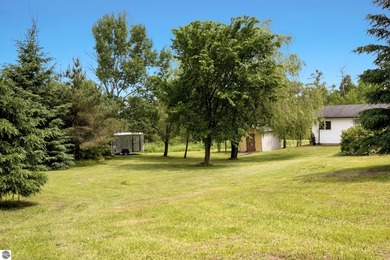 Set on 10 acres just outside Manton, this thoughtfully updated - photo 26