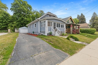Welcome home to this charming South Milwaukee bungalow featuring - photo 1