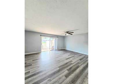 This waterfront ground-level 2-bedroom, 1-bath charmer comes - photo 3