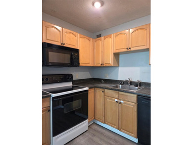 This waterfront ground-level 2-bedroom, 1-bath charmer comes - photo 7