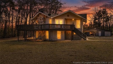 Set on 13+ private acres, this property offers a rare - photo 1