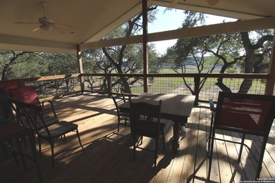 Nestled along the serene shores of Medina Lake, this charming - photo 14