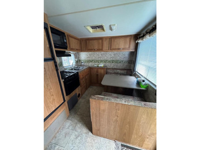 Lot with septic, camper, and room with a peek a boo view of the - photo 3