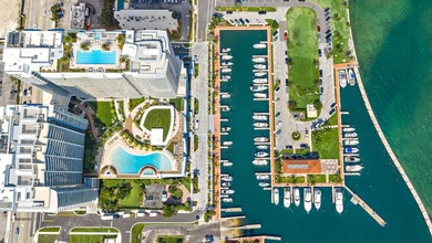 Perched on the 15th floor, this brand-new waterfront residence - photo 2