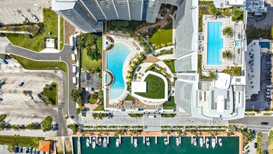 Perched on the 15th floor, this brand-new waterfront residence - photo 4