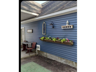 Nestled in a peaceful, private setting, this charming home - photo 4