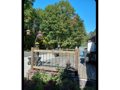 Nestled in a peaceful, private setting, this charming home - photo 8