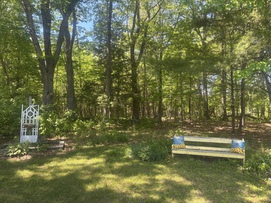 Nestled in a peaceful, private setting, this charming home - photo 9