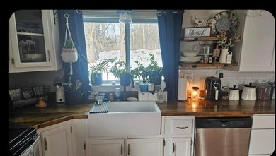 Nestled in a peaceful, private setting, this charming home - photo 10