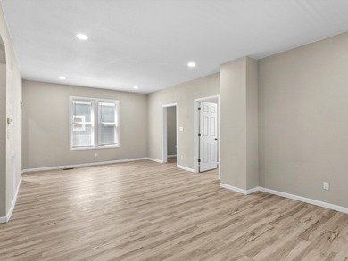 This beautifully renovated 5-bedroom, 2-bath home has been - photo 6