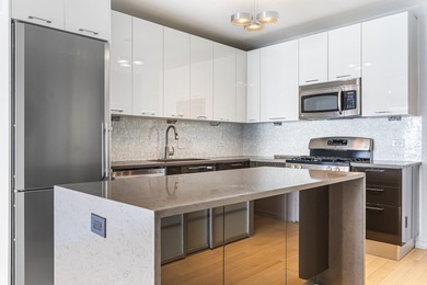 Don't miss this stunning, extra-wide 1-bedroom, 1.5-bath condo
