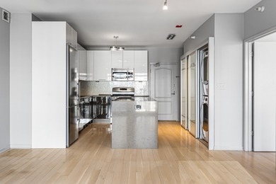 Don't miss this stunning, extra-wide 1-bedroom, 1.5-bath condo