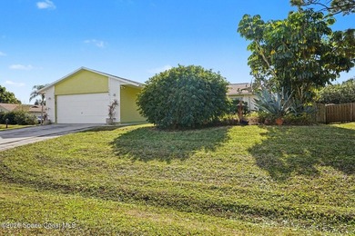 Nestled in the desirable NW Palm Bay community on a fully fenced - photo 2