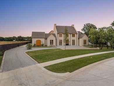 Nestled on a sprawling one-acre lot within the prestigious gated - photo 3