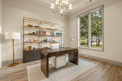 Nestled on a sprawling one-acre lot within the prestigious gated - photo 6