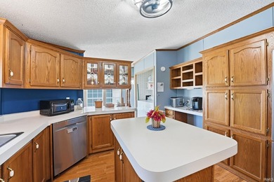 Discover turnkey lake living on Kuhn Lake, part of the - photo 14