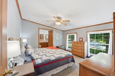 Discover turnkey lake living on Kuhn Lake, part of the - photo 19