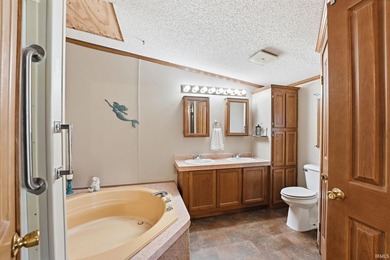 Discover turnkey lake living on Kuhn Lake, part of the - photo 20
