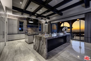 Perched at the pinnacle of Crystal Cove on a rare, single-loaded