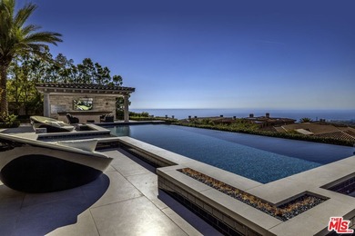 Perched at the pinnacle of Crystal Cove on a rare, single-loaded