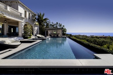 Perched at the pinnacle of Crystal Cove on a rare, single-loaded