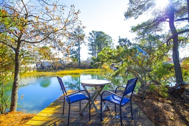 TURN KEY & FULLY FURNISHED. Beautiful custom coastal cottage