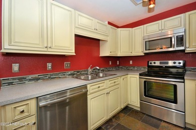 Discover this rare ground-floor unit nestled in a sought after - photo 12