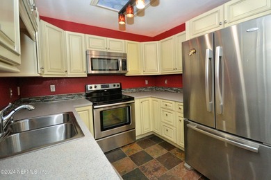 Discover this rare ground-floor unit nestled in a sought after - photo 13
