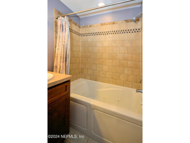 Discover this rare ground-floor unit nestled in a sought after - photo 17