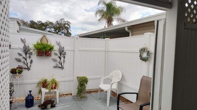 This charming 2-bedroom, 1.5-bath mobile home offers cozy - photo 3