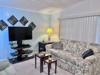 This charming 2-bedroom, 1.5-bath mobile home offers cozy - photo 5