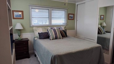This charming 2-bedroom, 1.5-bath mobile home offers cozy - photo 8