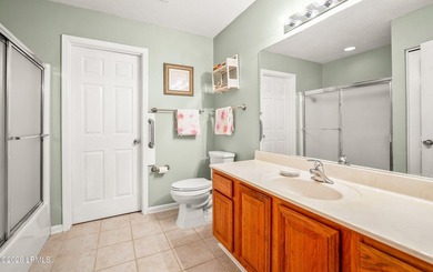 Private, spacious Royal Pines home with added rear porch and - photo 18