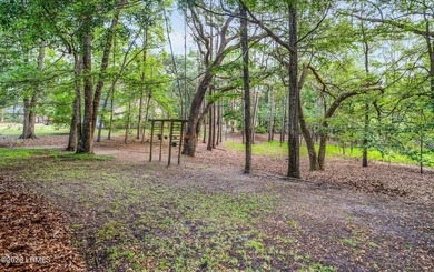 Private, spacious Royal Pines home with added rear porch and - photo 29