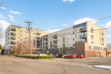Welcome to unit #702! This top-floor unit offers an open concept - photo 2
