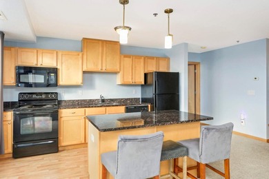 Welcome to unit #702! This top-floor unit offers an open concept - photo 5