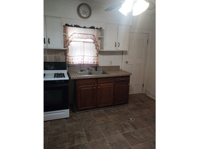 Affordable 2-bedroom Bungalow sits in the heart of a vibrant - photo 8